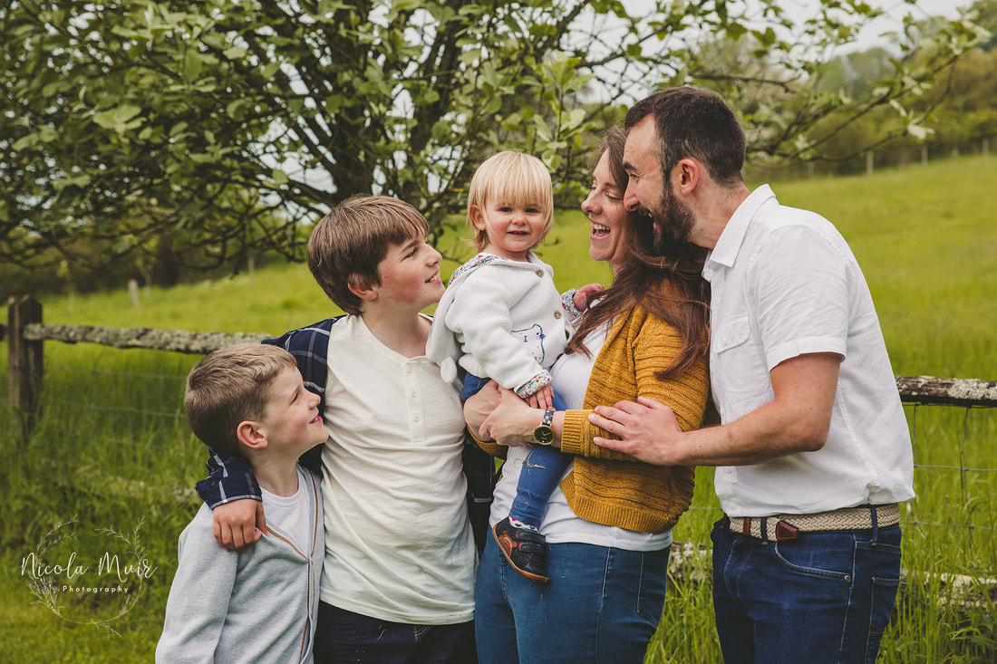 nicola muir photography pre wedding session upwaltham barns family cuddle smile